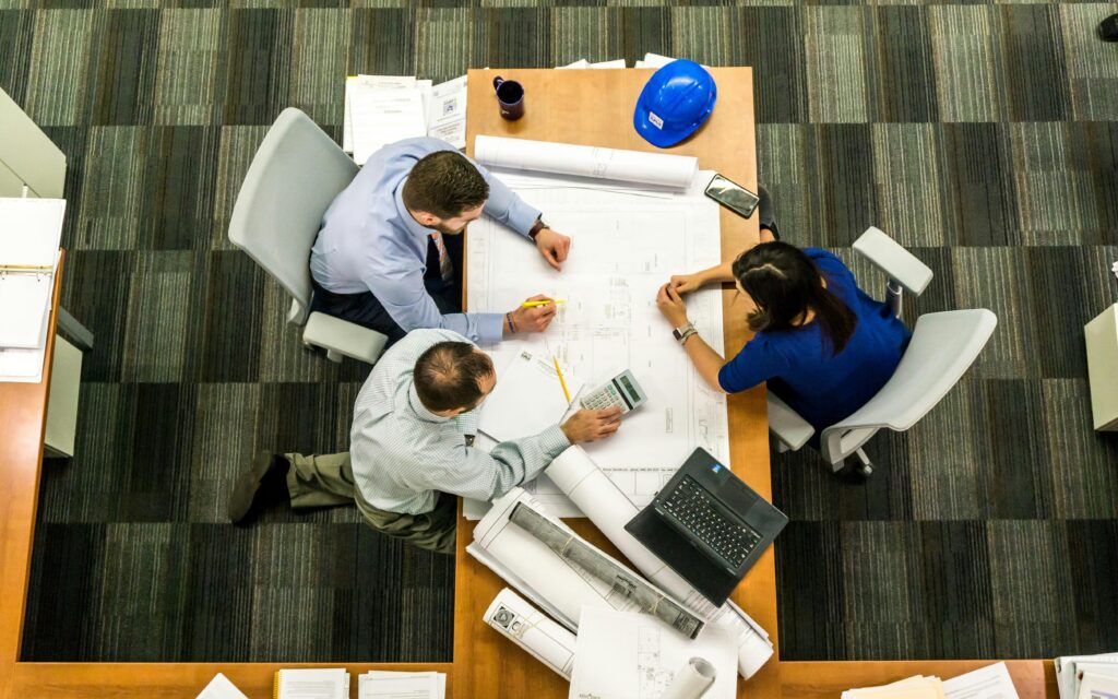 project managers sitting around table